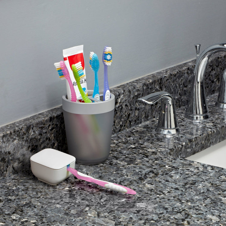 Tidy Teeth UV Toothbrush Sanitizer next to the sink